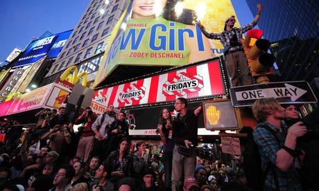 Occupy Wall Street participants stage a protest on Times Square in New York. A