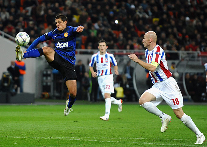 Tuesday Champions League: Javier Hernandez soars through the air as he controls a high ball