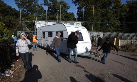 Activists move a caravan to a safer spot during evictions from Dale Farm travellers camp