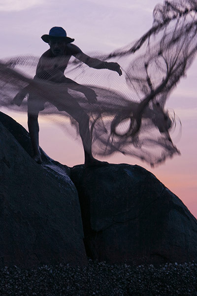 Sunset/sunrise: Rockpool fisherman in Palolem, Goa