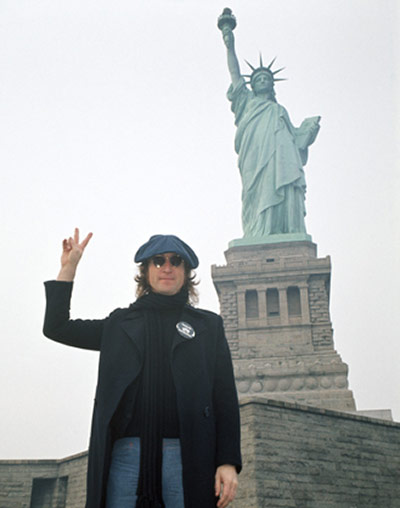 Rock Seen by Bob Gruen: John Lennon in front of The Statue of Liberty