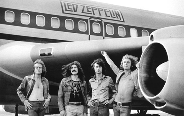 Rock Seen by Bob Gruen: Led Zeppelin in front of plane in New York