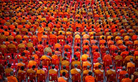 Thousands of Buddhist monks attend an alms offering ceremony in Bangkok