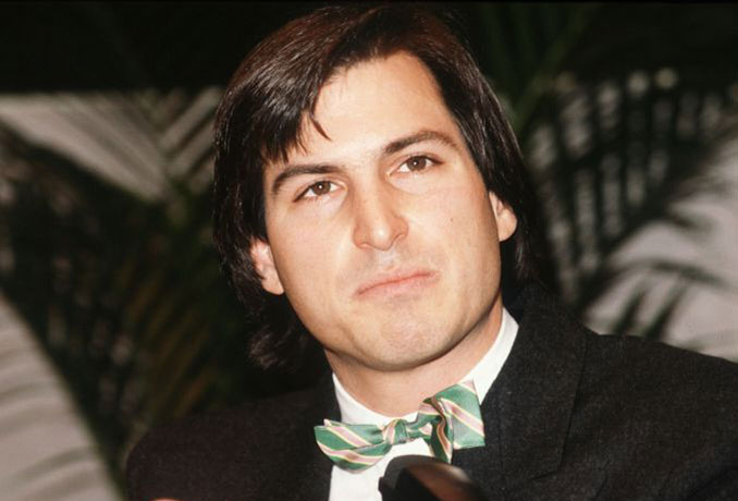 steve jobs dies: 1984: Steve Jobs in a bow tie as he unveiled the Apple Macintosh