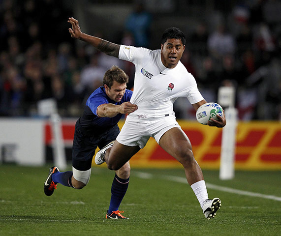England v France: Manu Tuilagi goes on a surging run but is stopped by Vincent Clerc