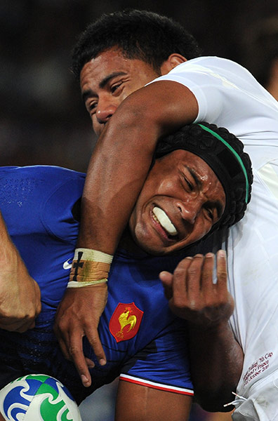 England v France: Thierry Dusautoir feels the power of England's center Manu Tuilag