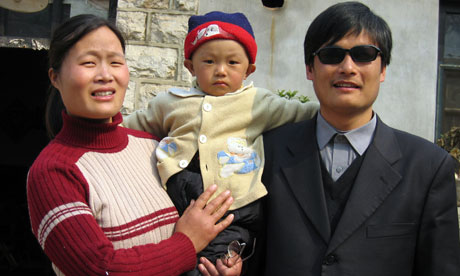Blind activist Chen Guangcheng with his wife and son in Shandong 2005