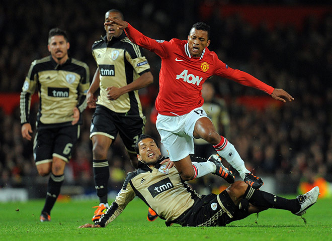 Champions League Tuesday: Benfica's Ezequiel Garay fouls Manchester United's Nani