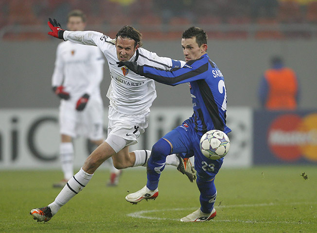 Tuesday Champions League: Basel's Marco Streller attempts to go past Otelul Galati's Adrian Salageanu