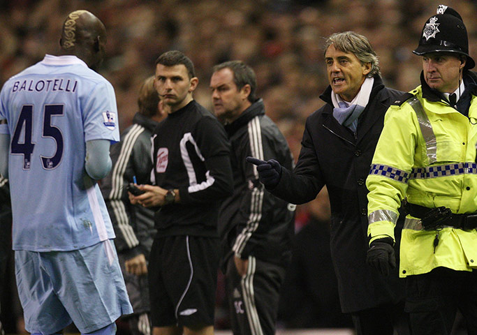 Sunday football: Roberto Mancini reacts after Mario Balotelli is sent off against Liverpool