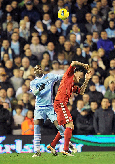 Sunday football: Mario Balotelli challenges Martin Skrtel