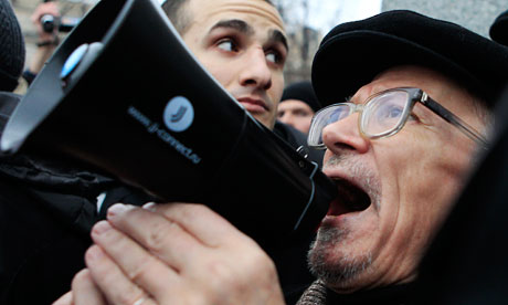 Opposition leader Eduard Limonov addresses the crowds at Bolotnaya Square
