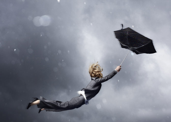 Viewfinder13feb: Woman being blown away by an umbrella