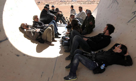 Photojournalists, including New York Times photographers Tyler Hicks and Lynsey Addario in Libya
