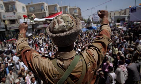 A Yemeni army defector joins protesters demanding the resignation of President Ali Abdullah Saleh