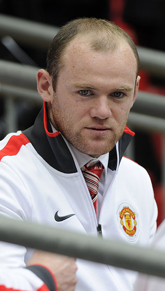 Man City v Man Utd: Wayne Rooney sits on the bench as he is banned serving a two match ban