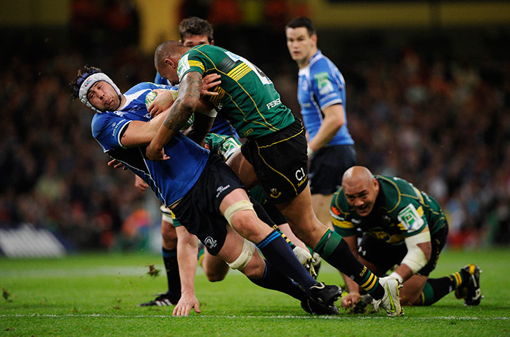 Heineken Cup Final: Kevin McLaughlin receives a big hit in the first half from Courtney Lawes