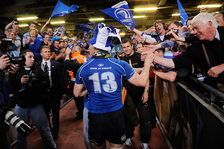 Heineken Cup Final: Brian O'Driscoll walks down the tunnel past celebrating Leinster fans