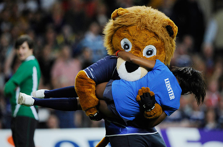 Heineken Cup Final: The Leinster mascot carries off a cheerleader at half-time