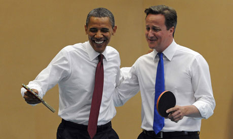 Barack Obama and David Cameron play table tennis at Globe Academy, London, on 24 May 2011.