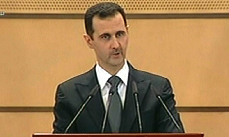 Syrian President Bashar al-Assad addressing the nation from Damascus University
