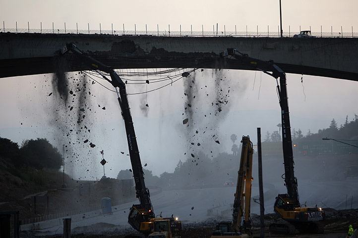Carmageddon: Workers demolish the south side of Mulholland overpass