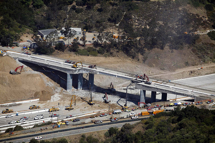 Carmageddon: Workers demolish the Mulholland Drive bridge along the closed 405 freeway 