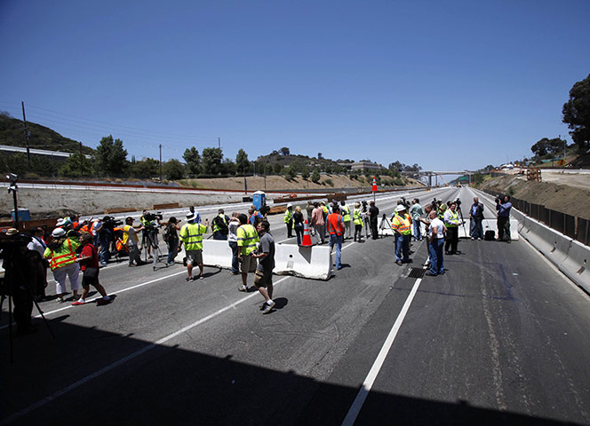 Carmageddon: Members of the media are escorted on the 405 freeway