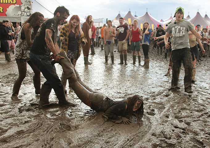 Reading/Leeds festival: August 26: Festivalgoers in the mud during the Reading Festival