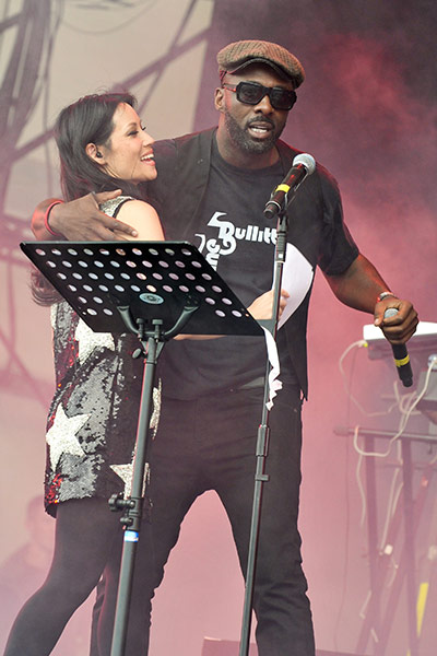 Big chill: Lucy Liu and Idris Elba perform on stage with The Bullitts