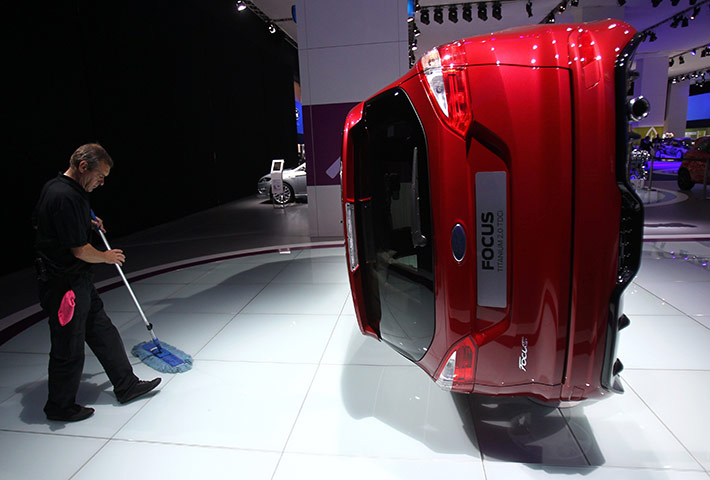 Frankfurt motor show: A worker cleans the stand of car manufacturer Ford during preparation work 