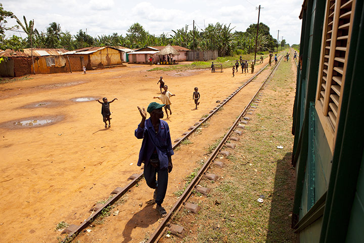 Benin : benin, kids running alongside guy catherine's vintage train 