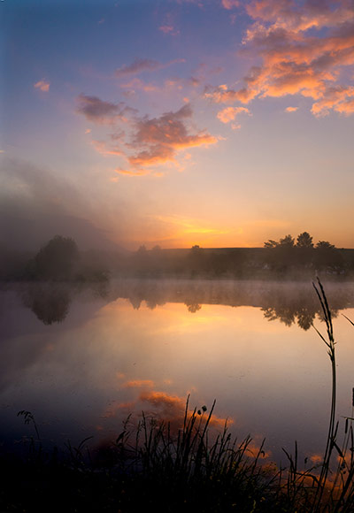 slovakia: Sun rising over a small pond near Stara Lesna.