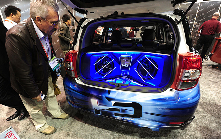 CES 2012: A man checks out a Scion SD vehicle with a Scosche HD soundsystem 