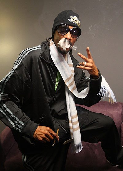 Week in music: Snoop Dogg poses backstage