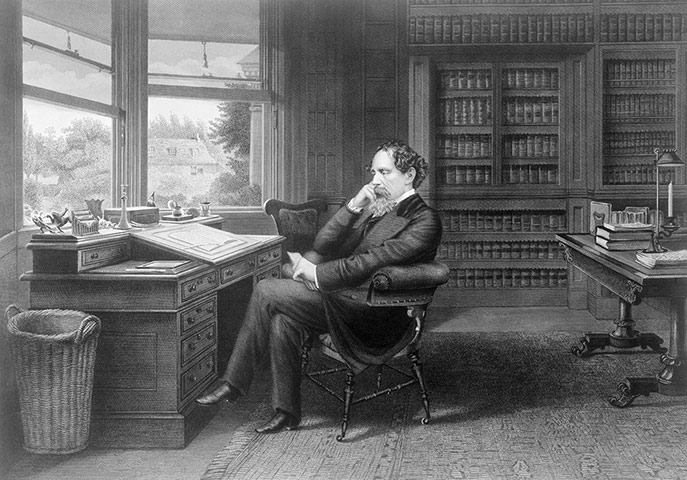 dickens interiors gallery: Charles Dickens in his study