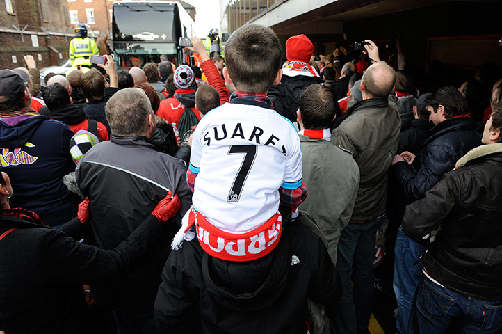 Liverpool v Man Utd: Fans watch the coach arrive ahead of the Liverpool v Man Utd game