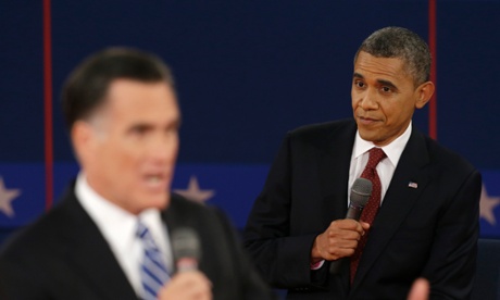 President Barack Obama listens as Republican presidential nominee Mitt Romney speaks during the second presidential debate at Hofstra University.