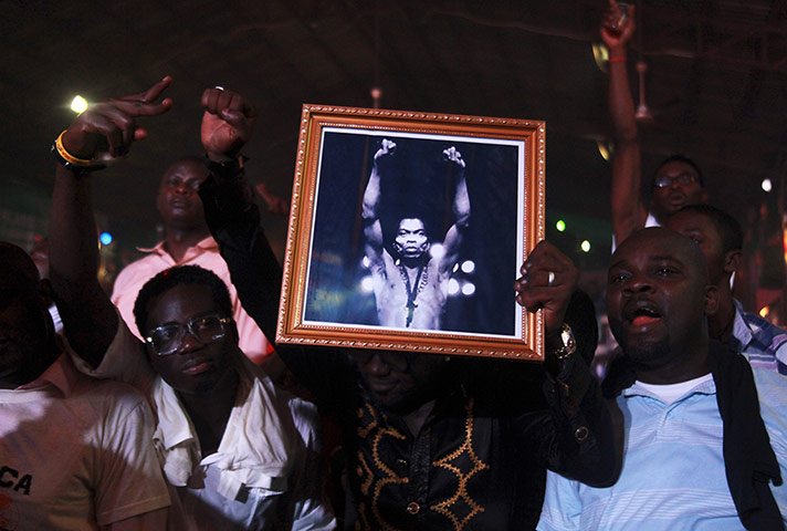 Week in music: Fans hold up a photo of Nigeria's music legend Fela Kuti