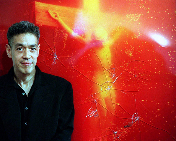 Defaced art: Andres Serrano stands in front of Piss Christ