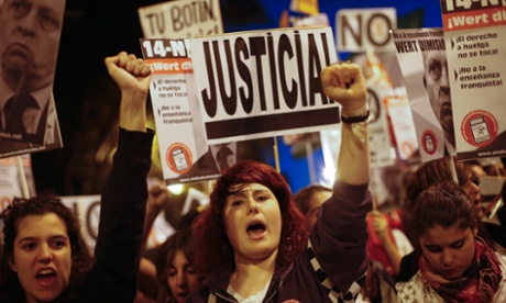 Demonstrators shout slogans as they take part in a march during a 24-hour nationwide general strike in central Madrid November 14, 2012.
