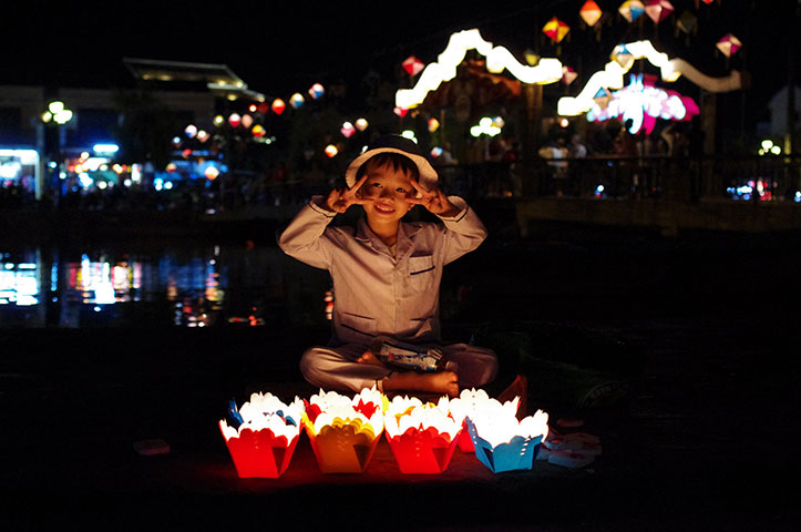 Readers comp Nov2012: Young boy selling floating lanterns in Hoi An, Vietnam