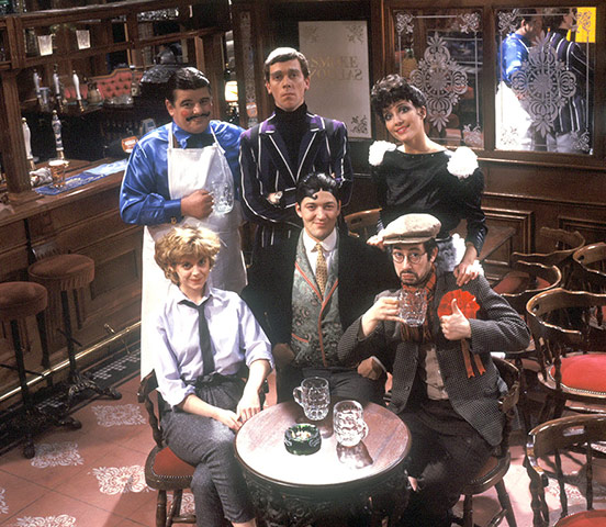 Robbie Coltrane: Group of characters from a scene from TV show 'Alfresco'