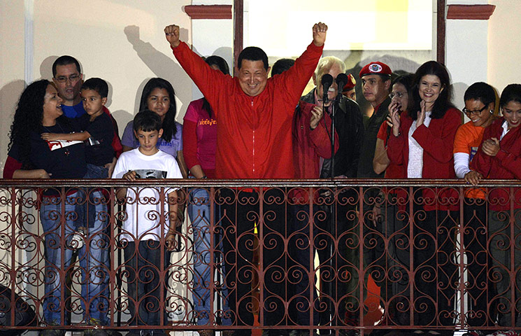 Chavez: Chávez greets his supporters after receiving news of his reelection