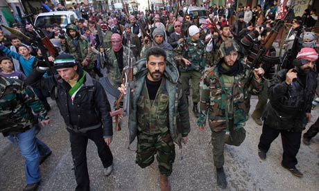 Syrian rebels march during a demonstration in Idlib