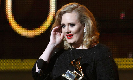 Adele accepts her award for Best Pop Solo Performace at the Grammys