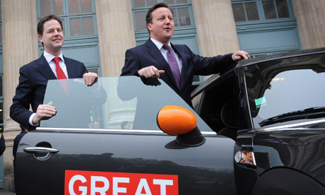 David Cameron and Nick Clegg with a Great Britain-branded Mini at Gare du Nord station in Paris