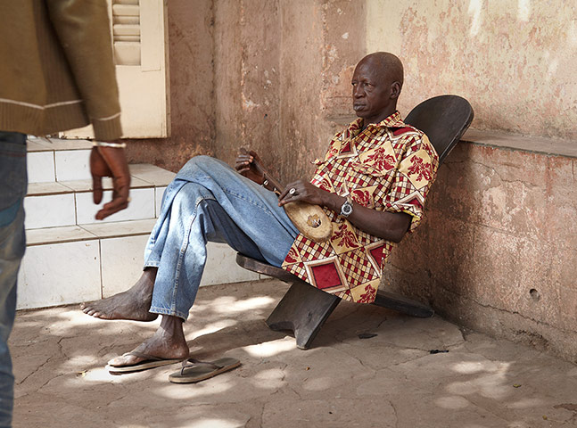 Amadou and Mariam: A musician plays on the streets of Bamako