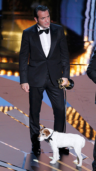 Oscars 2012: winners: Jean Dujardin of France holds Uggie the dog