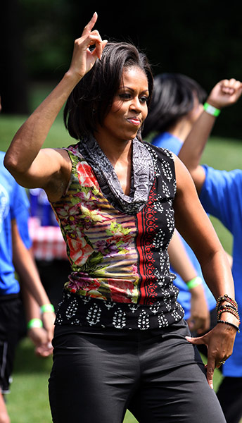 Michelle Obama fitness:  First Lady Michelle Obama exercises with children on the South Lawn